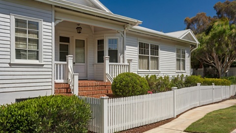 Local painter painting and repairing a fence for an Australian residential property