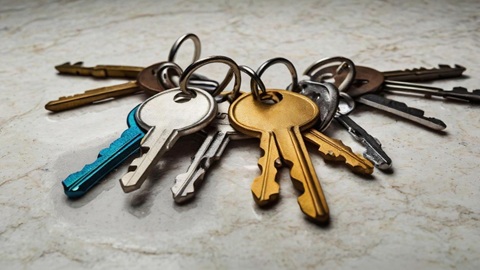 Licensed locksmith repairing a lock for an Australian residential property