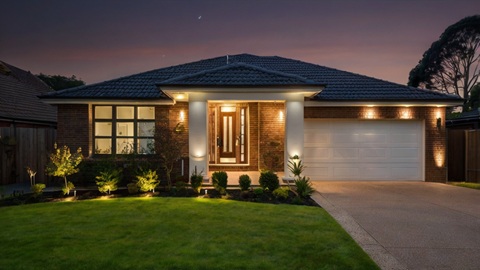 Professional installer setting up outdoor lighting for an Australian residential property